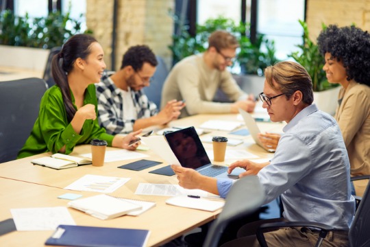 business-meeting-group-of-multiracial-people-sitting-at-the-desk-in-the-modern-coworking 540x360